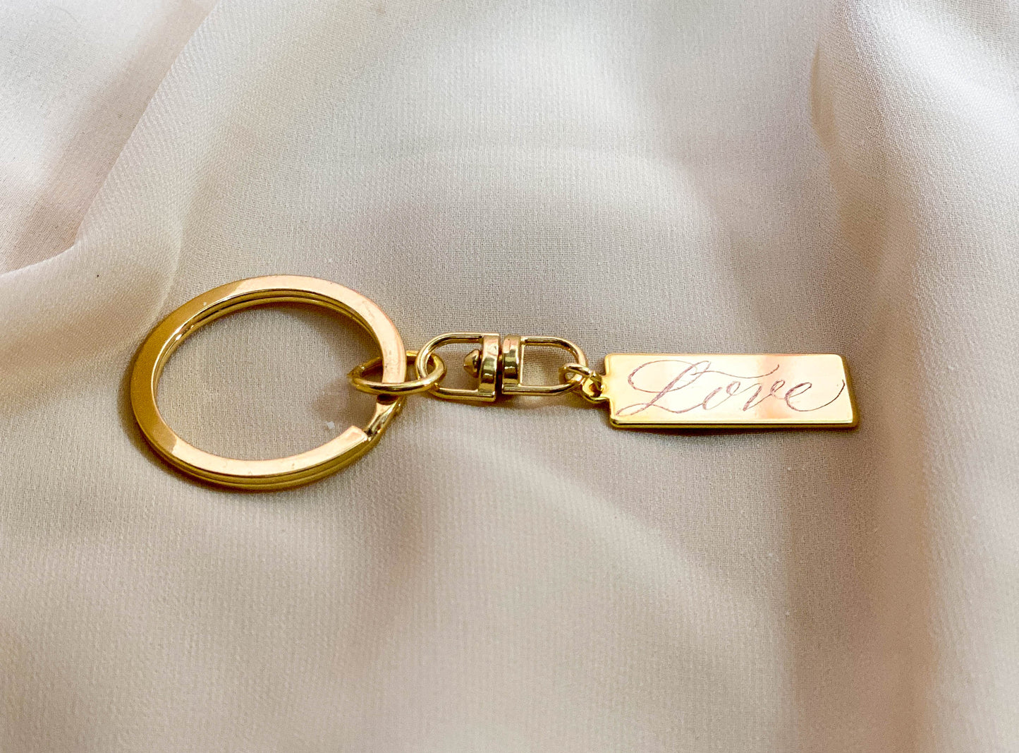 engraved gold bar love calligraphy