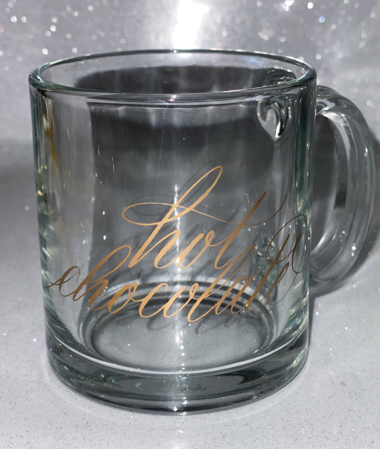 Empty gold hot chocolate calligraphy glass mug
