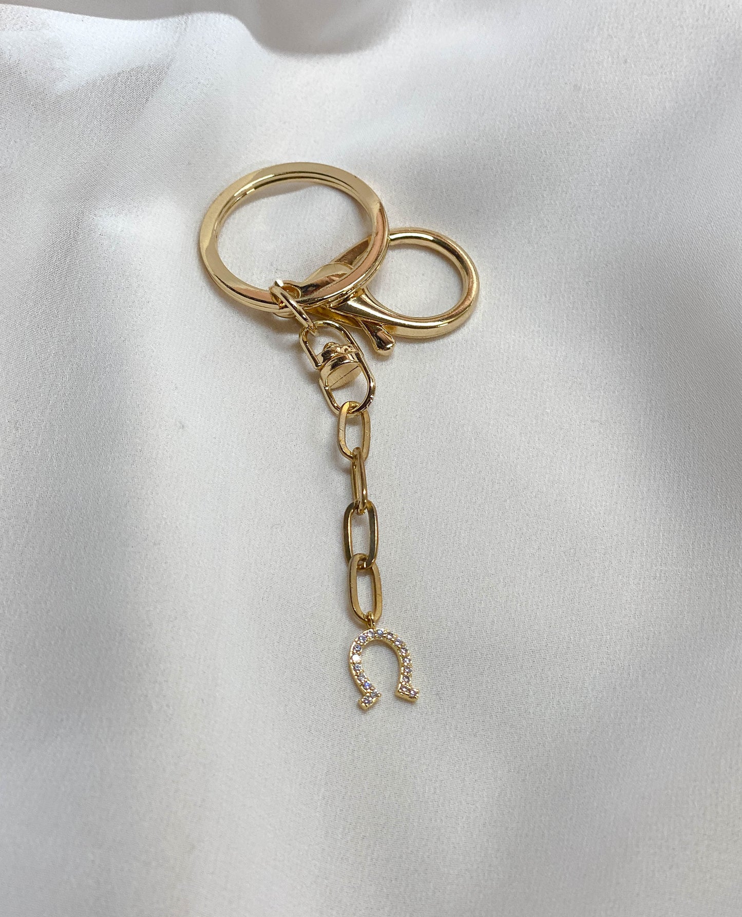Gold pave horseshoe bag charm