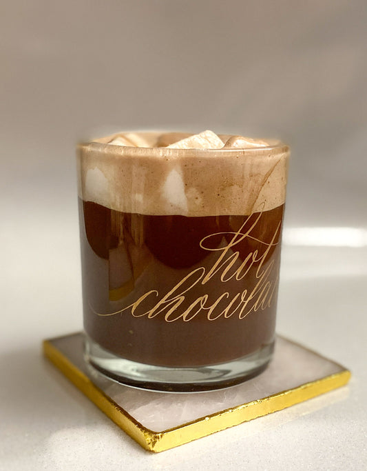 Gold hot chocolate calligraphy glass mug on a rose quartz coaster